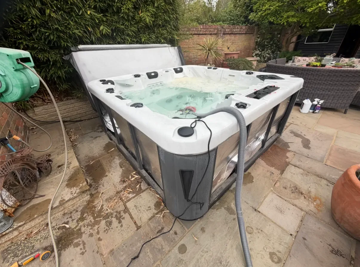 Outdoor spa on a paved garden patio